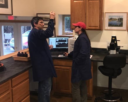 Two scientists at a lab bench with a FlowCam