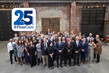 A group of about 40 people with FlowCam 25 Years logo overlaid