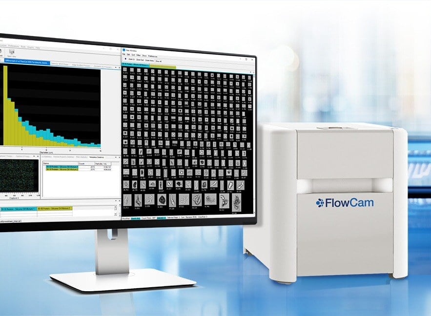 FlowCam 8000 instrument on lab benchtop with particle data and images on a monitor